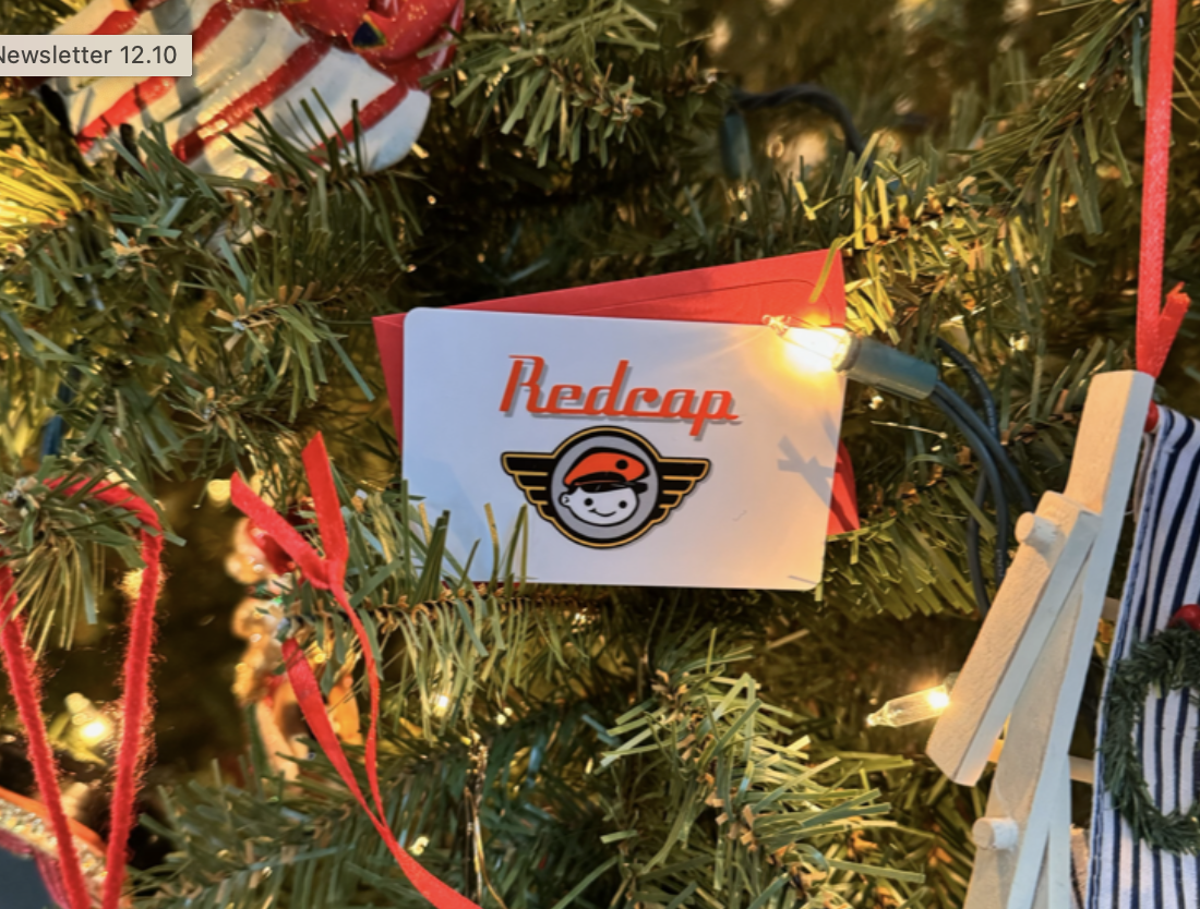 A Redcap gift card nestled in a Christmas Tree